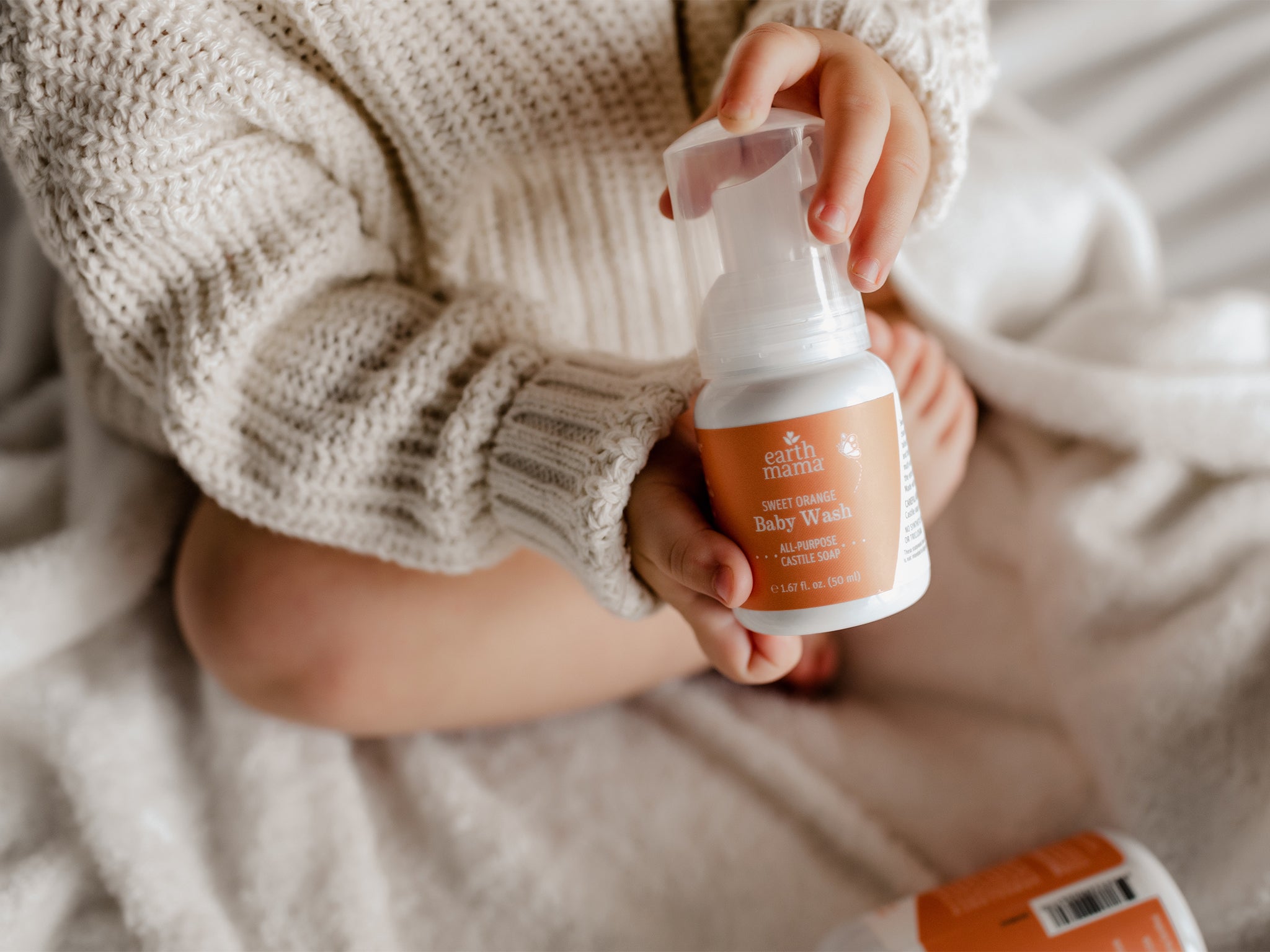 Photo: Sweet Orange Baby Wash held by child